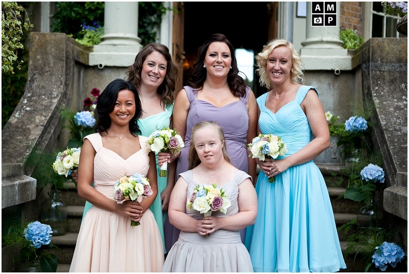 "Pastel-coloured-bridesmaids-dresses-Hampton-Court-House"
