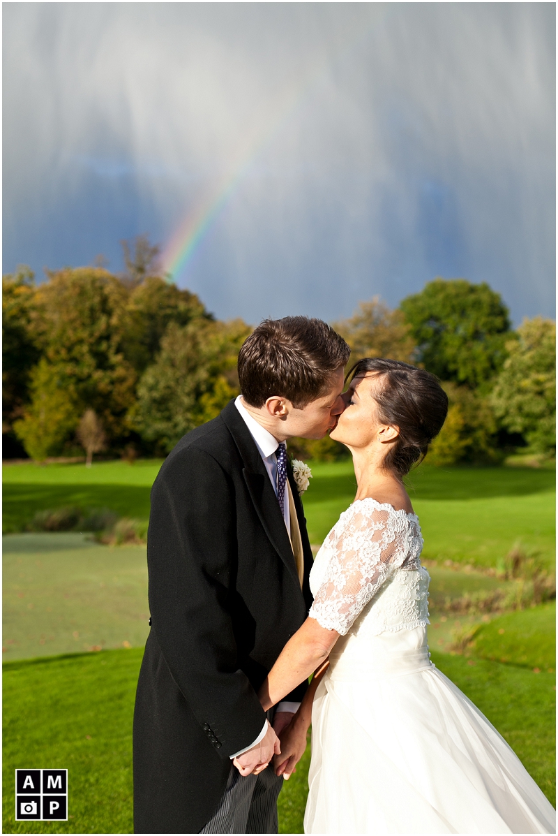 "bridal-couple-photo-with-a-rainbow-background"