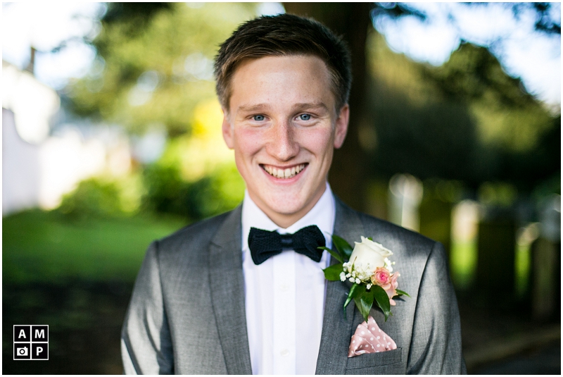 "smiling-groom-at-church-in-Devon"