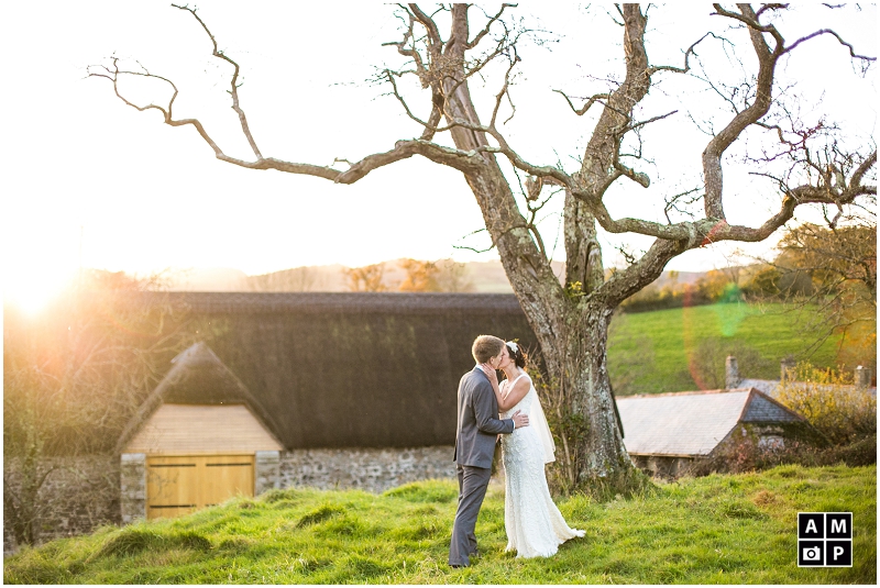 "Sunset-couple-photos-with-a-pear-tree-Great-Barn-Devon"