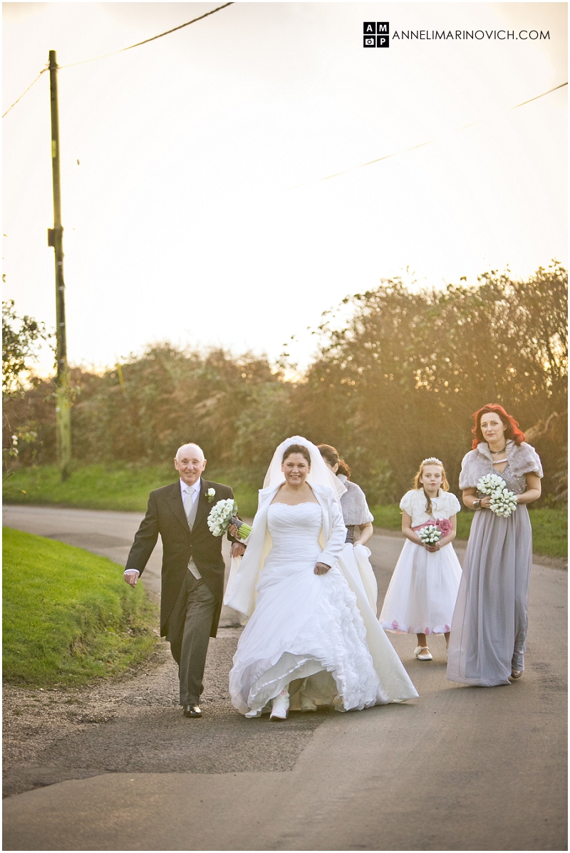 "bride-walking-to-the-church"