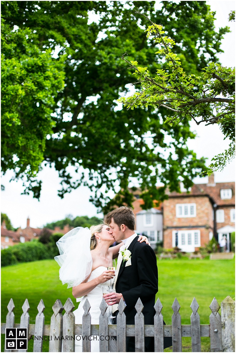 "bride-and-groom-kissing-under-an-oak-tree"