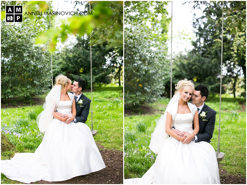 "bride-and-groom-kissing-on-a-garden-swing"
