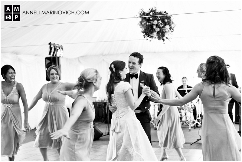 "bridesmaids-dancing-around-bride-and-groom"
