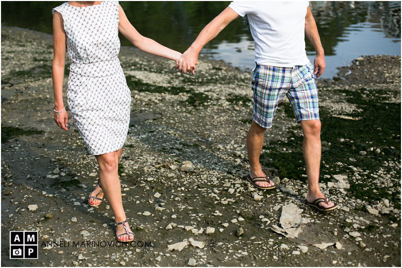 "couple-walking-on-the-riverbank"