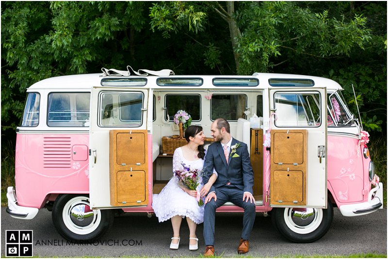"Bride-and-groom-in-Calico-Moon-pink-VW-van"