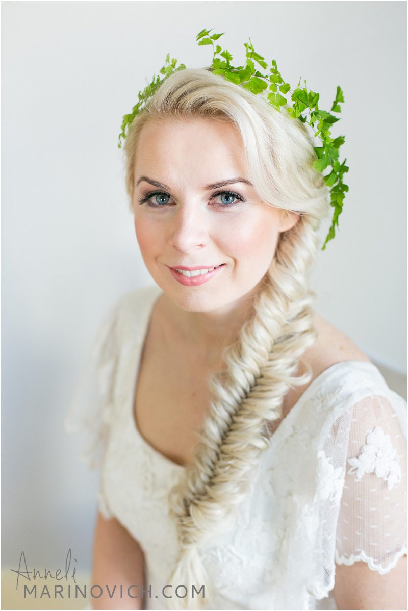 "bride-with-fishtail-braid-and-foliage-in-her-hair"