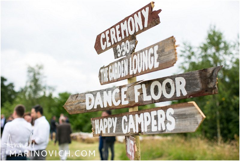 "wedding-in-a-field-wooden-signs"