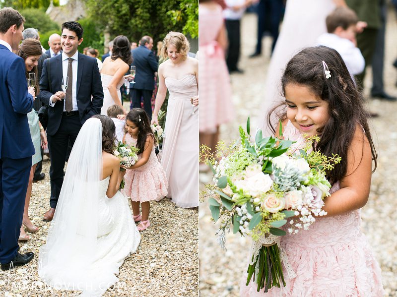 "bride-having-a-moment-with-flowergirl"