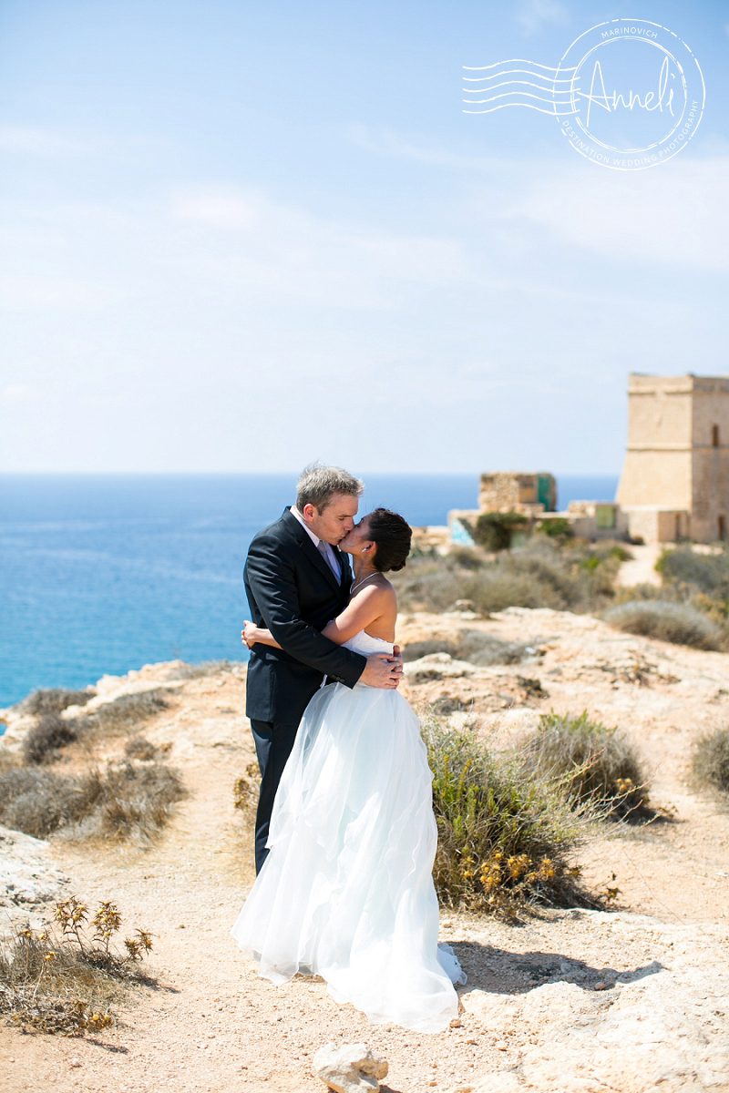 "Elegant-bride-and-groom-at-Għajn-Tuffieħa-Malta"