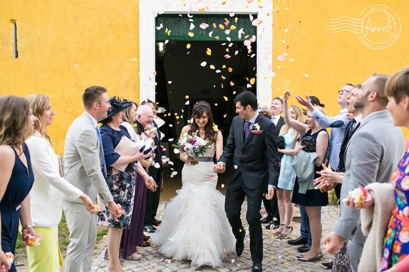 "Rose-petal-bride-and-groom-exit"