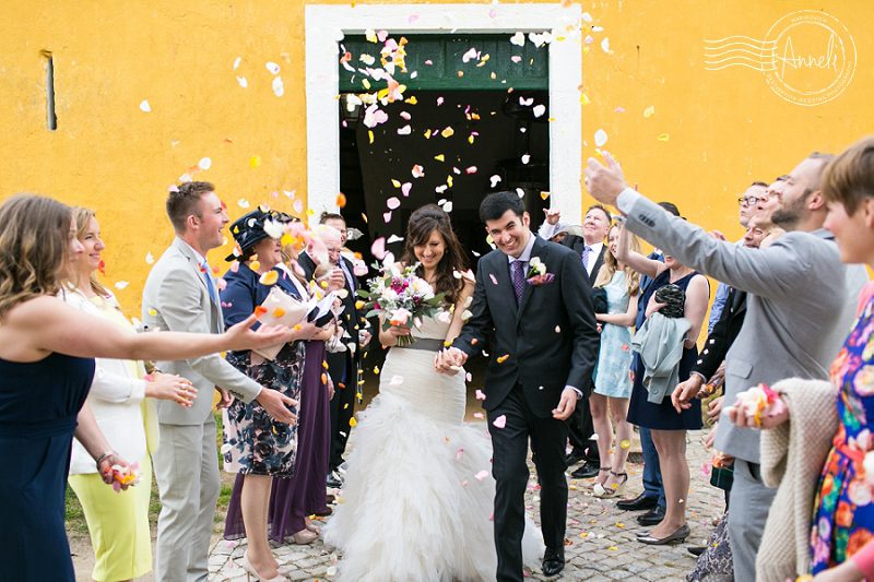 "Colourful-rose-petal-bride-and-groom-exit"
