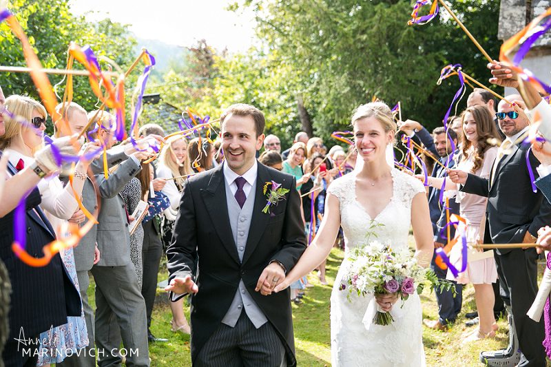 "Streamers-church-exit-for-The-Great-Barn-Devon-Wedding-couple"