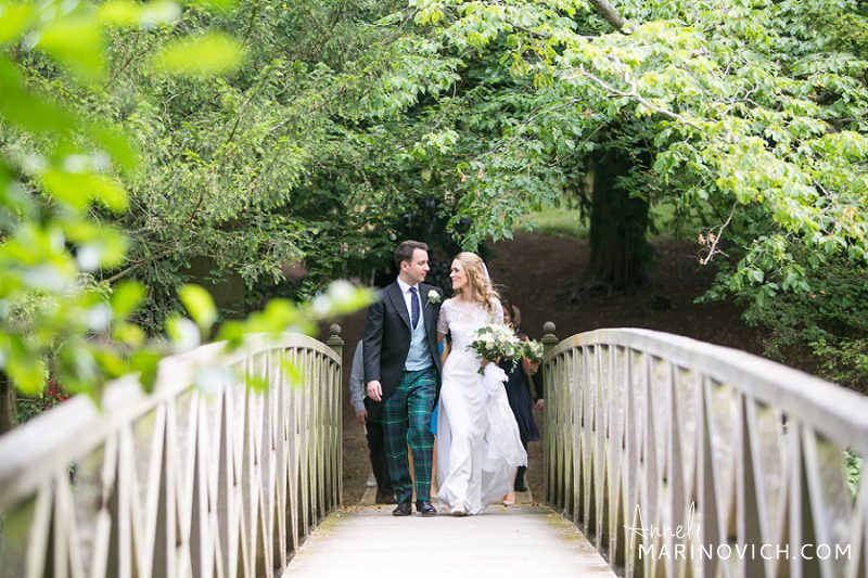 "Chiddingstone-Castle-footbridge-wedding-couple-photos"
