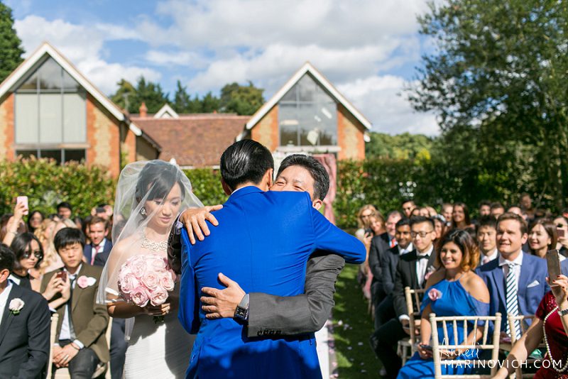 "Bride-father-hugging-groom-at-English-wedding"