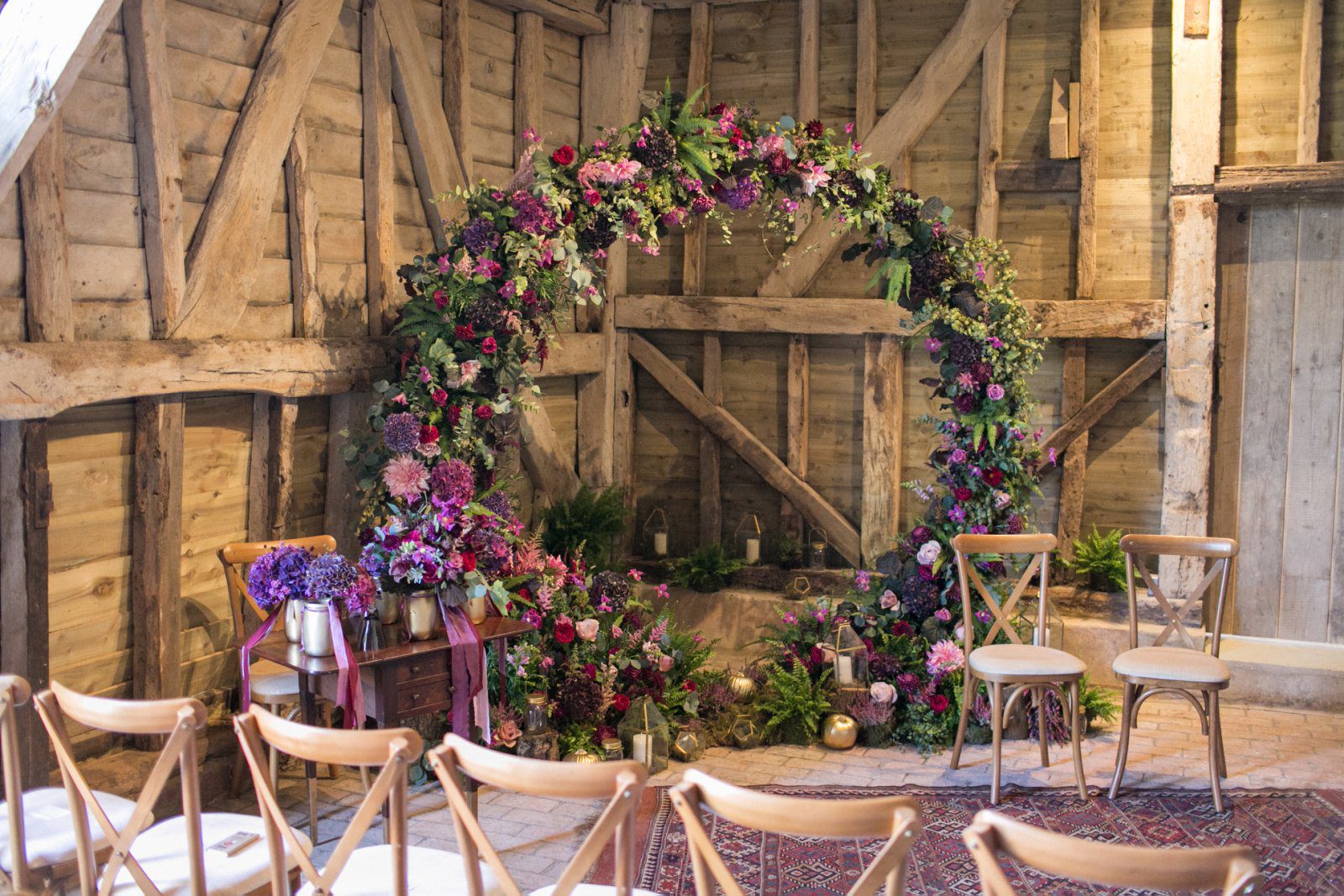 A moongate arch used as a ceremony backdrop at High Billinghurst Farm