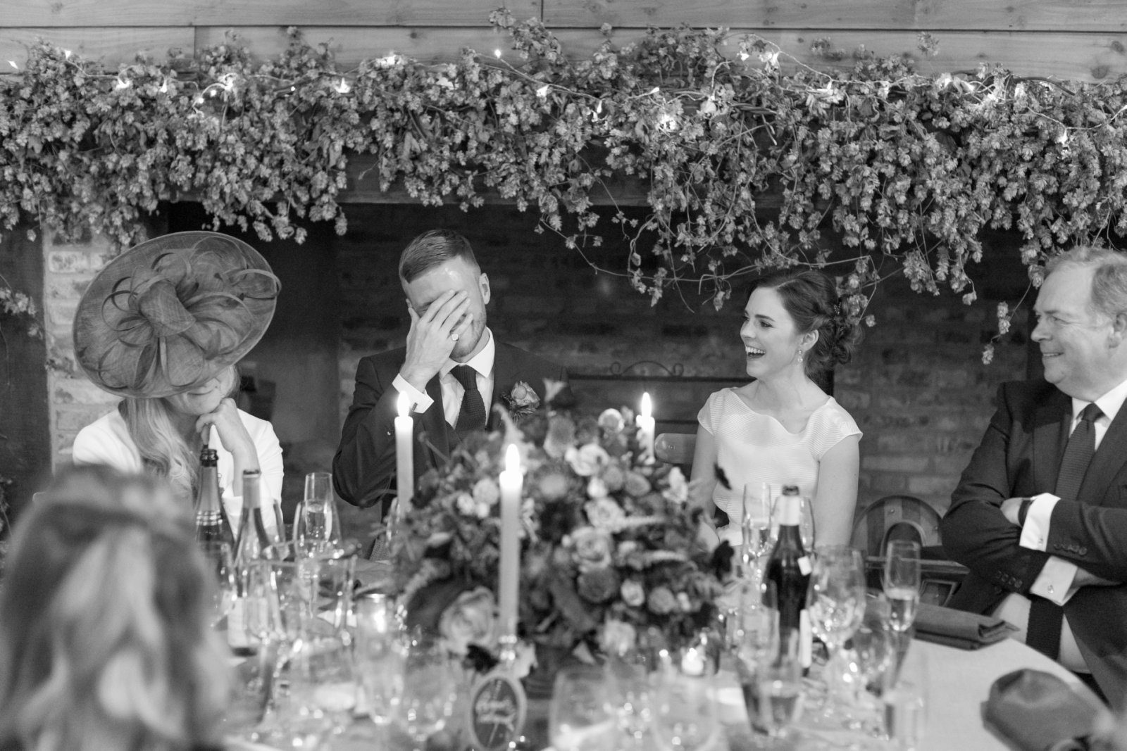 Candid photos of guests listening to wedding speeches at High Billinghurst Farm