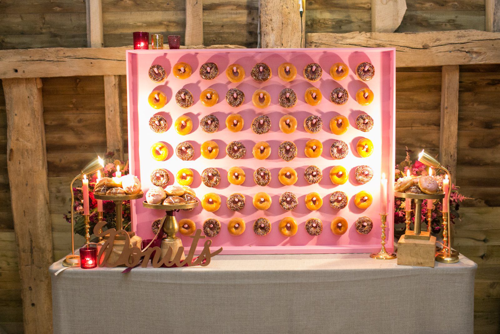 A donut wall served as a late night snack at a High Billinghurst Farm wedding