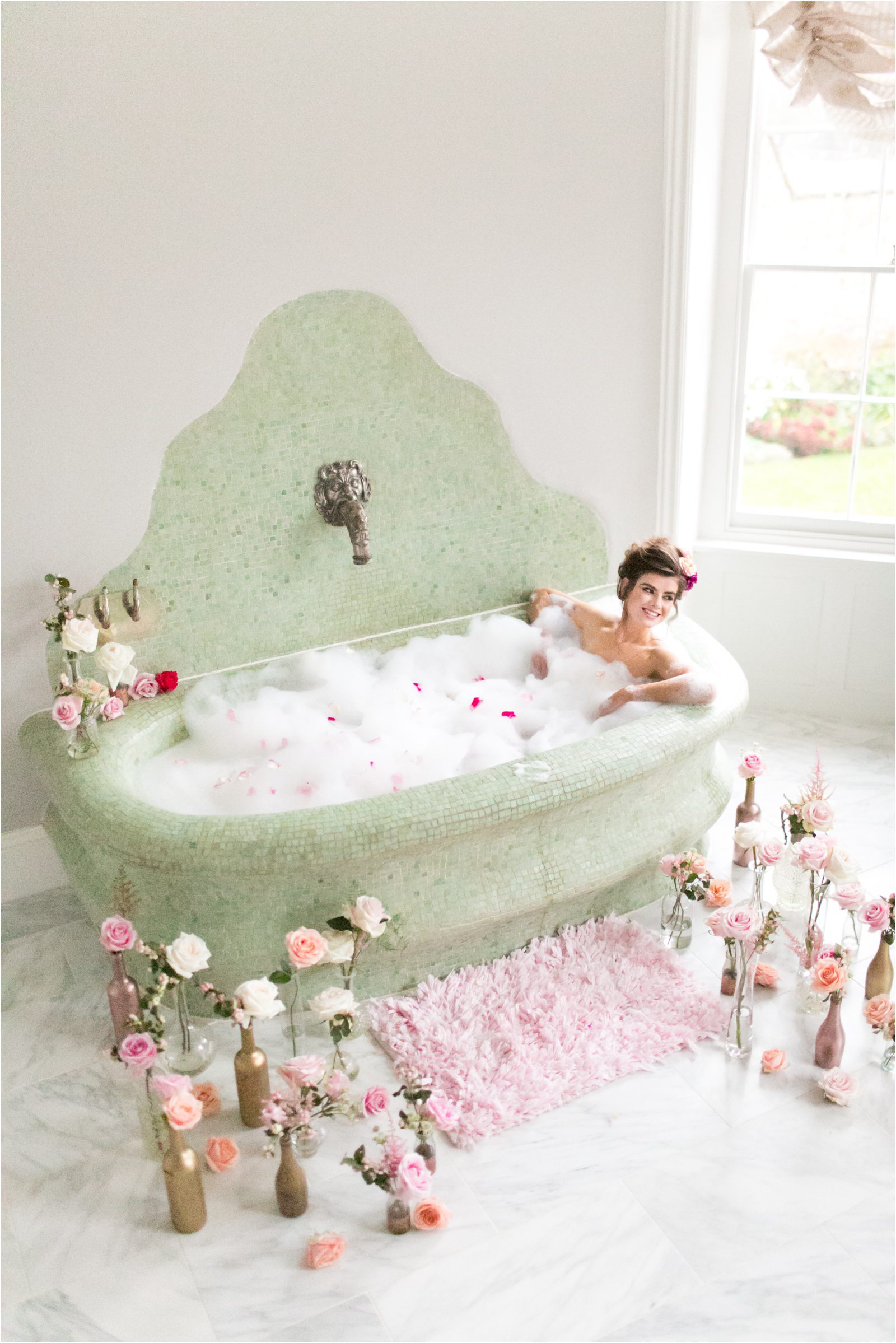 Bride in a mint green mosaic bath tub