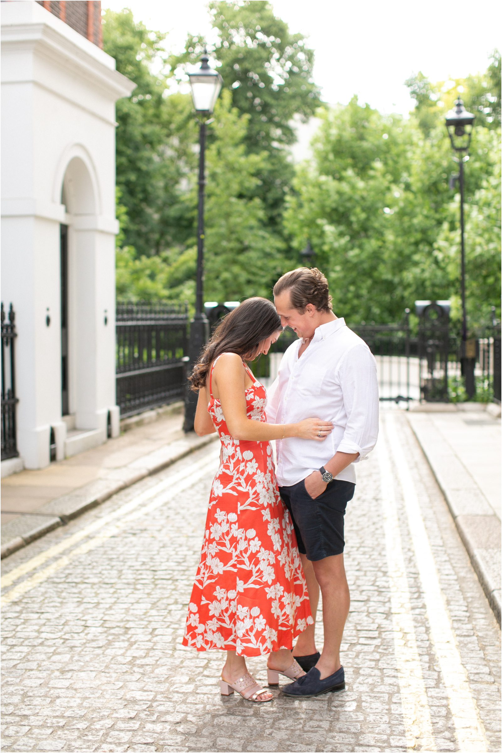 Cute London couple laughing during their engagement shoot