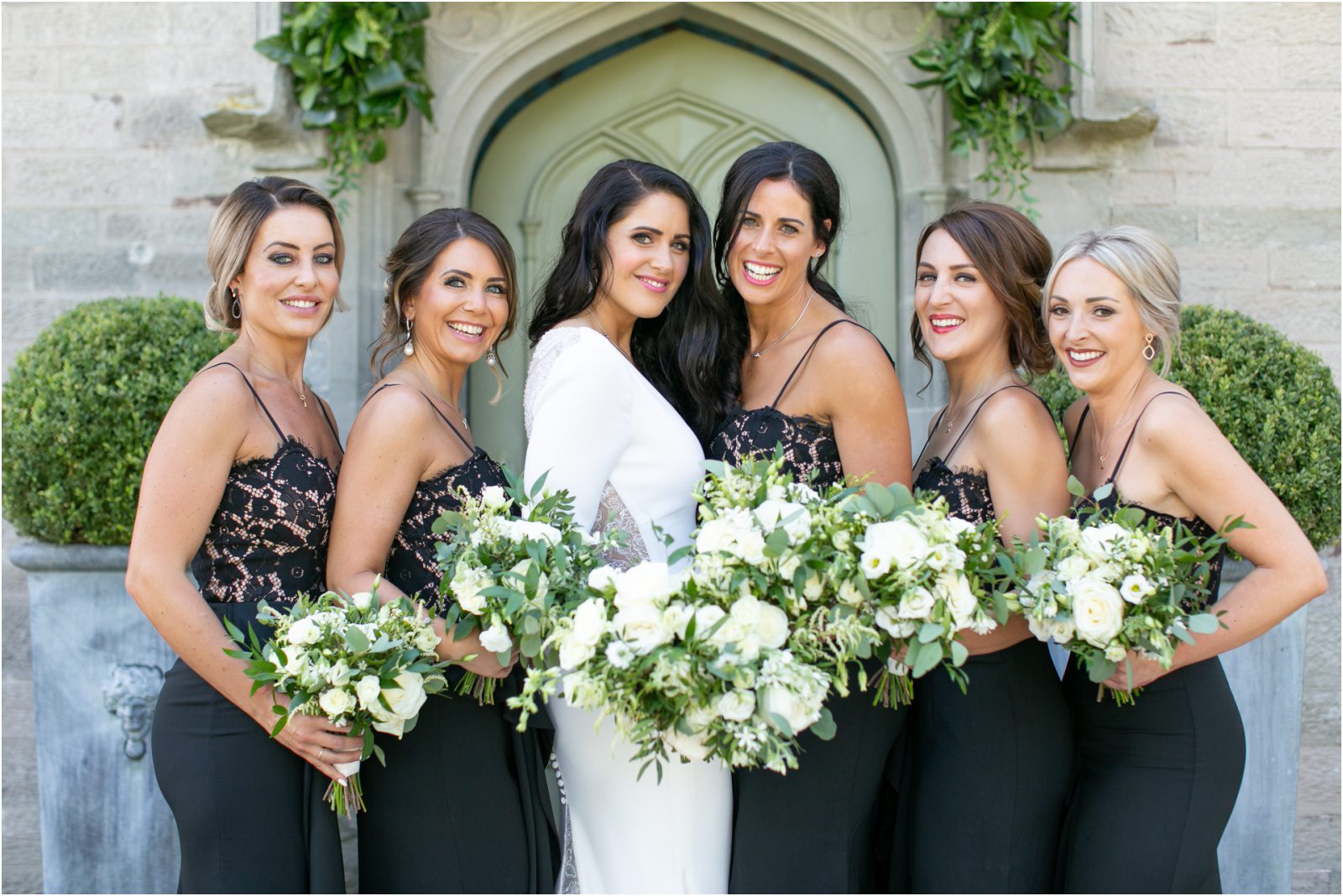 Pronovias bride and bridesmaids in black at Lemore Manor