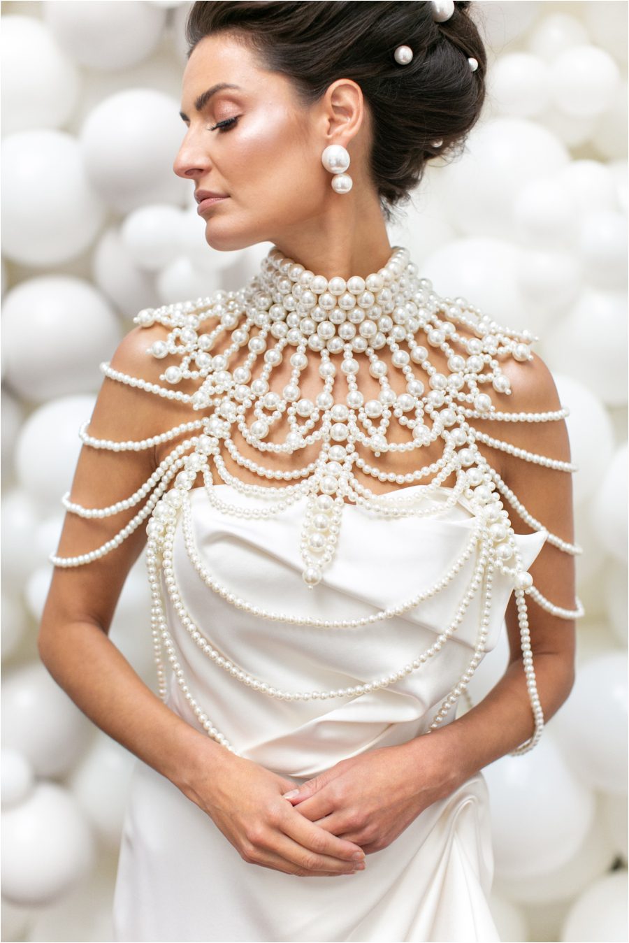 Modern bride wearing statement pearl necklace