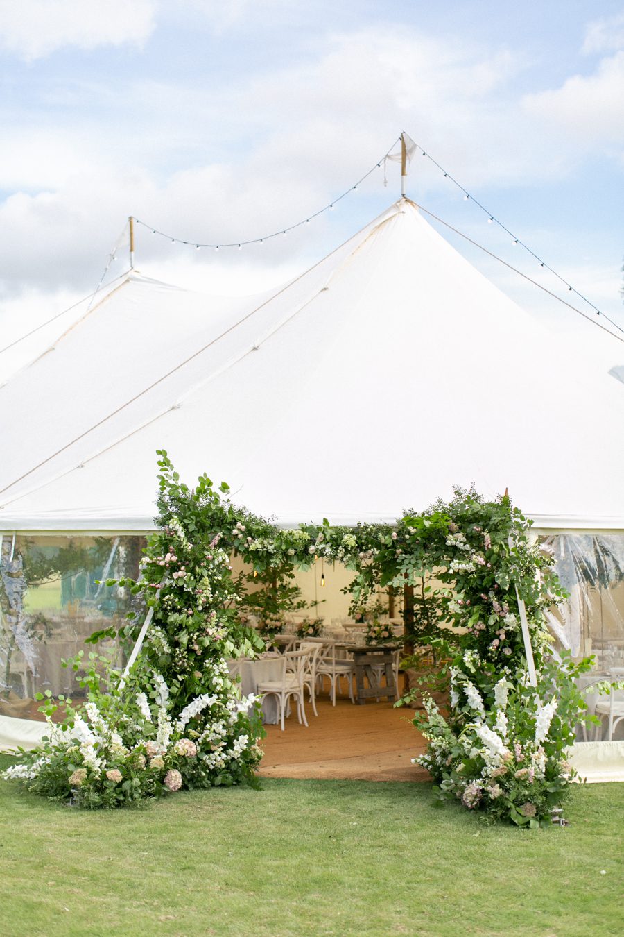Floral arch marquees entrance for a wedding