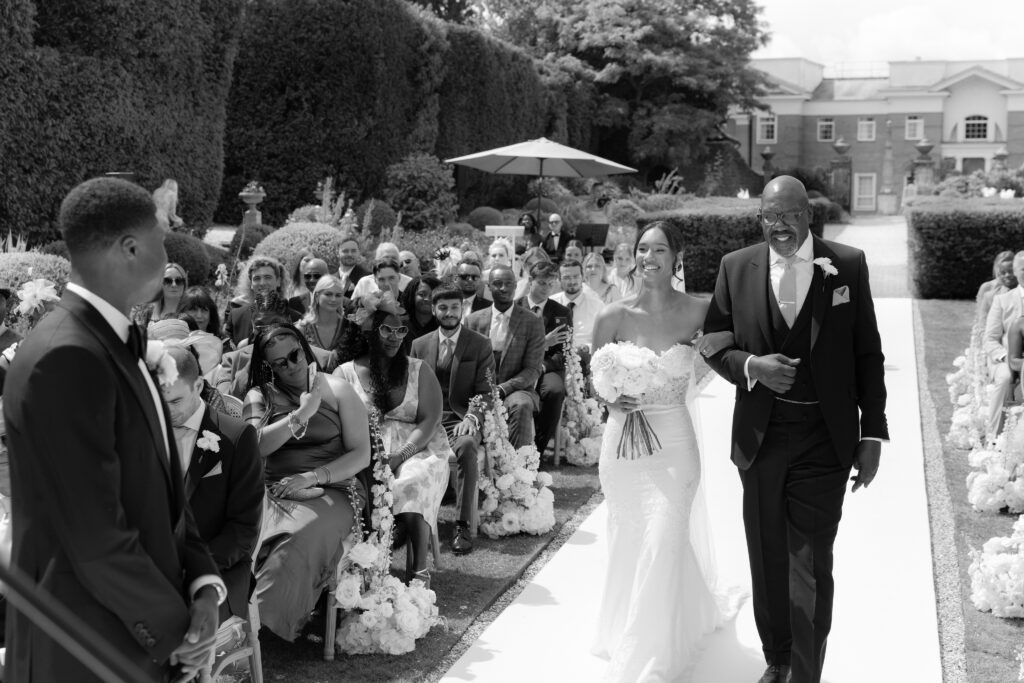 Bride walking down the aisle at Four Seasons Hampshire