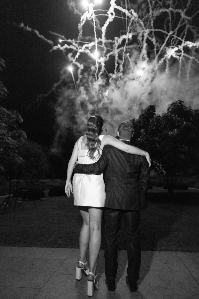 bride and groom enjoying a fireworks display at their Middleton Lodge wedding
